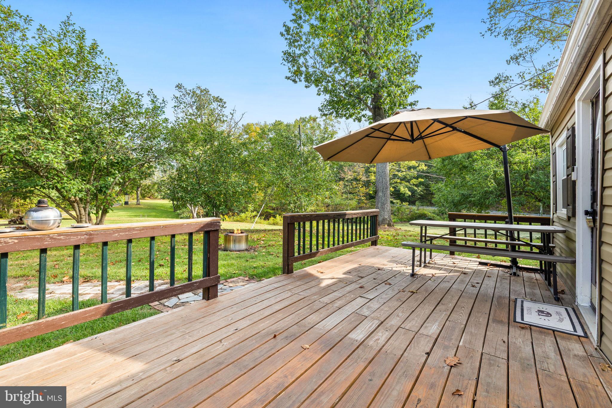 4440 Dumfries Road Catlett, VA 20119 - Photo 4 of 38 a view of balcony with wooden floor and outdoor seating