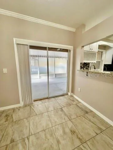 a view of a livingroom with wooden floor and cabinet