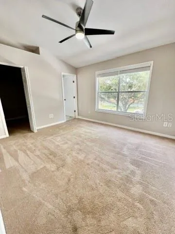 a view of an empty room with a window