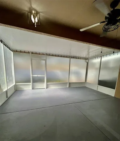 a view of an empty room with a fireplace