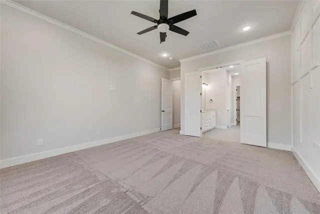 an empty room with fan and a ceiling fan