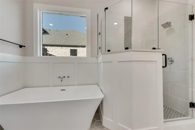 a bathroom with a bathtub and a sink