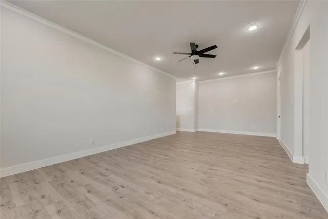 an empty room with a ceiling fan & a ceiling fan