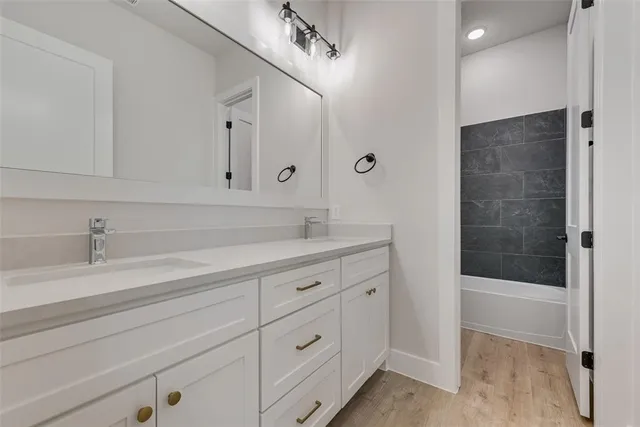 a spacious bathroom with a shower and a sink