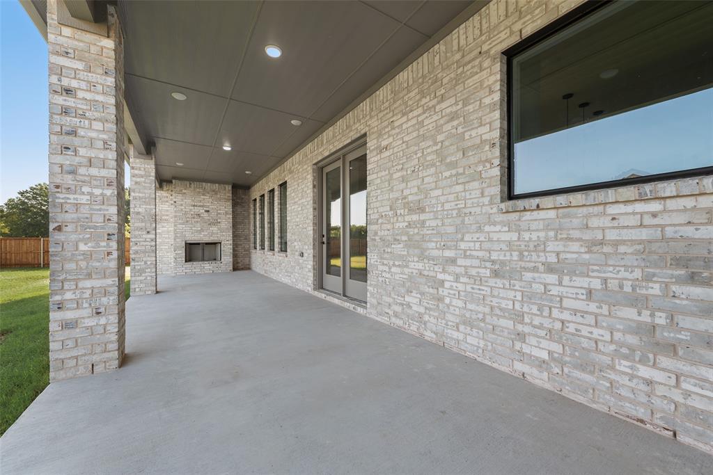 1342 Benjamin Trail Van Alstyne, TX 75495 - Photo 35 of 39 a view of an empty room with a fireplace