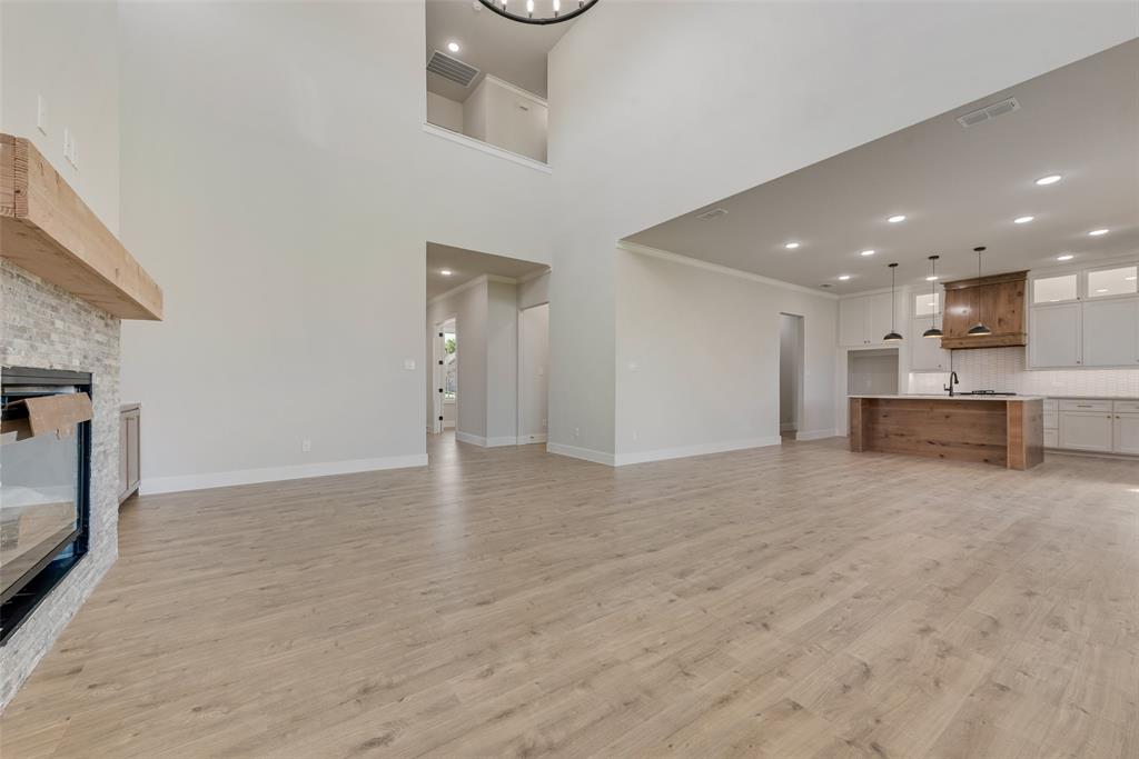 1342 Benjamin Trail Van Alstyne, TX 75495 - Photo 5 of 39 a view of a kitchen with a sink and a fireplace