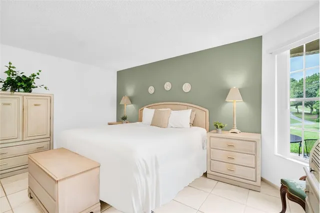 a bedroom with a bed and a cabinets