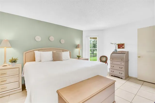 a bedroom with a bed and cabinets