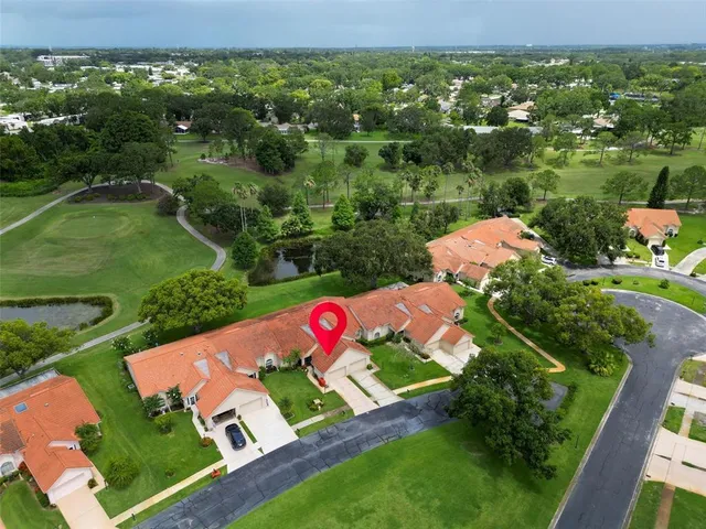 an aerial view of residential house with outdoor space and street view