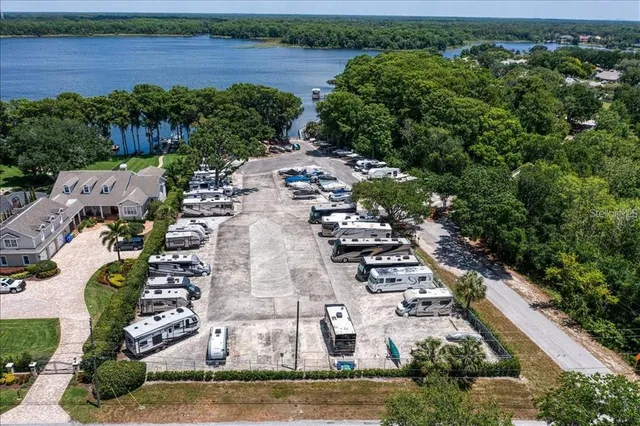 an aerial view of a house with a lake view