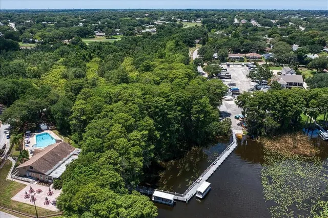 an aerial view of a house with a yard