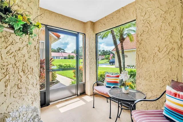 a reading room with furniture and a window