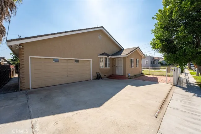 a view of a house with a street