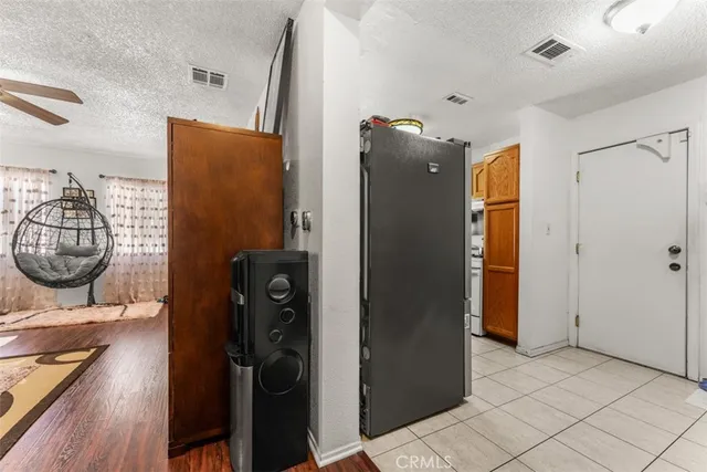 a view of a entryway door with hallway and closet