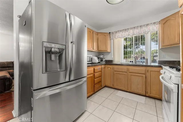 a kitchen with a refrigerator and a sink