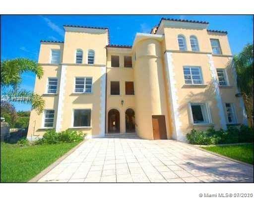 4812 Pine Tree Drive, Unit 203 Miami Beach, FL 33140 - Photo 12 of 19 a view of a building with many windows