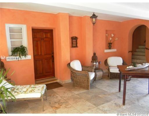4812 Pine Tree Drive, Unit 203 Miami Beach, FL 33140 - Photo 17 of 19 a living room with furniture a rug and a window