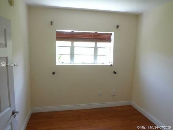 4812 Pine Tree Drive, Unit 203 Miami Beach, FL 33140 - Photo 8 of 19 an empty room with a window