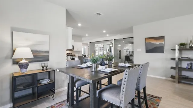 a living room with fireplace furniture and a flat screen tv