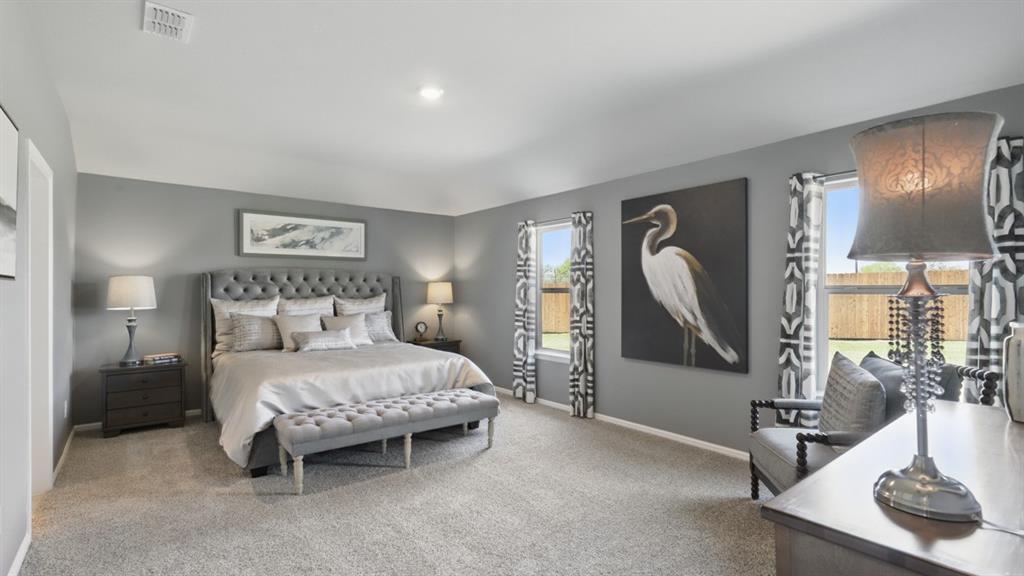 1636 Tin Roof Road Krum, TX 76249 - Photo 16 of 35 a bedroom with a bed and a dresser