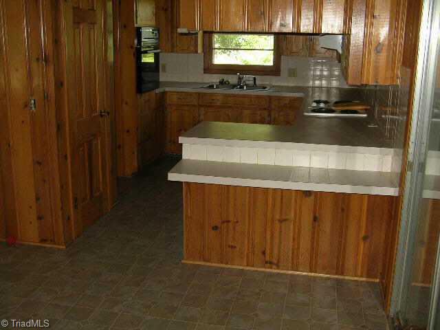 342 Culler Road Pinnacle, NC 27043 - Photo 3 of 9 Other. Kitchen with built-in table counter