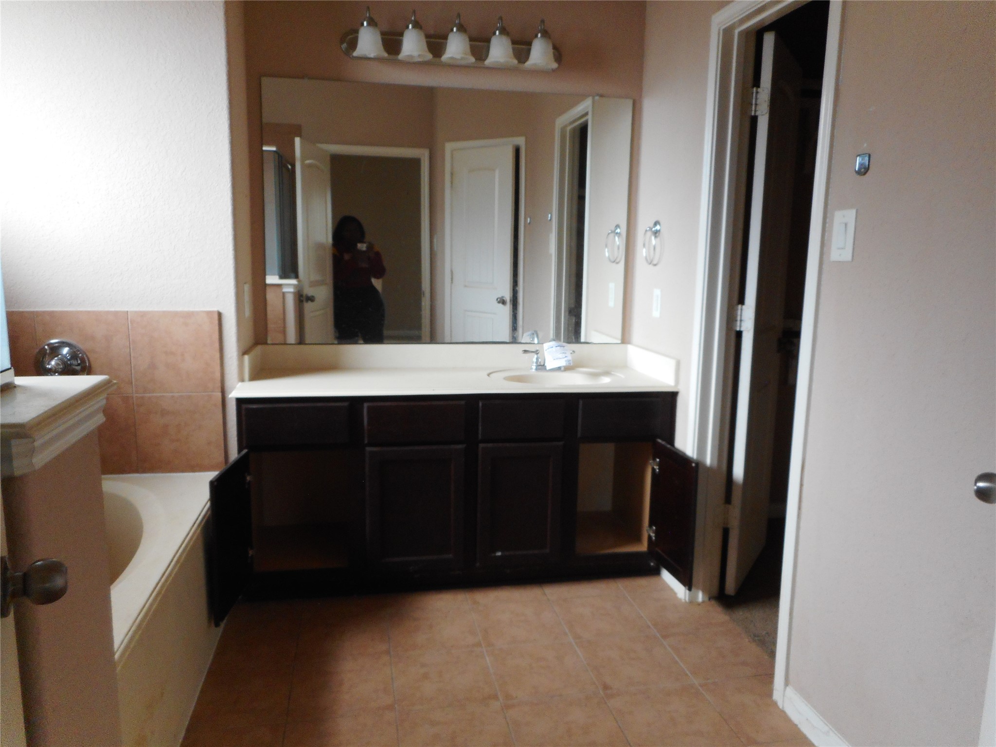 21418 Forest Colony Drive Porter, TX 77365 - Photo 7 of 21 a living room with a mirror and a sink