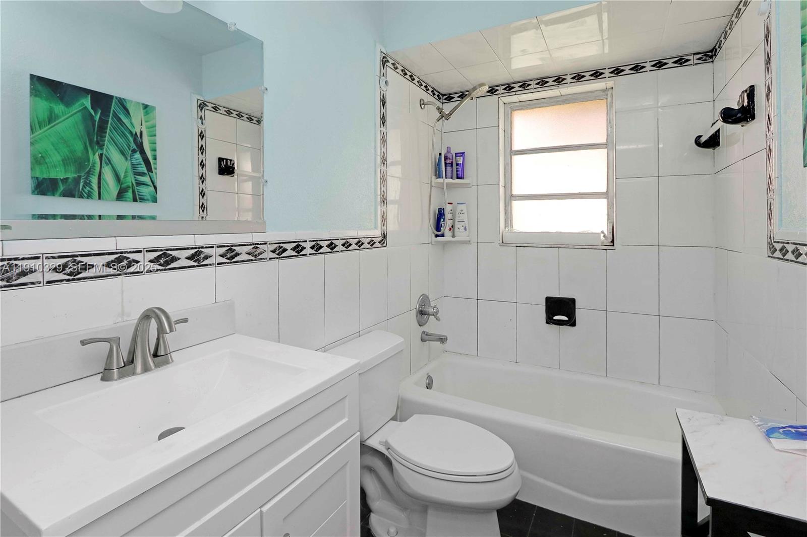 12305 Southwest 94th Terrace Miami, FL 33186 - Photo 12 of 29 a bathroom with a sink toilet and shower