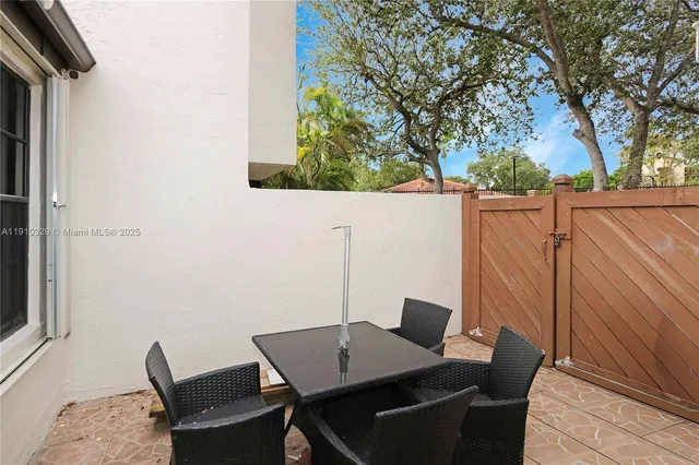 a balcony view with a seating space