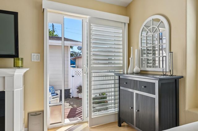 a kitchen with a sink and a mirror