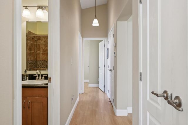 a view of a bathroom from a hallway