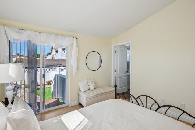 a living room with furniture a lamp and a chandelier