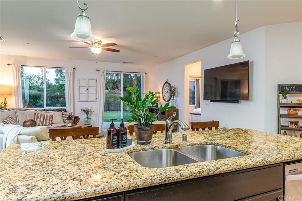 1039 Ford Drive Nipomo, CA 93444 - Photo 13 of 45 a kitchen with a faucet a sink and chandelier