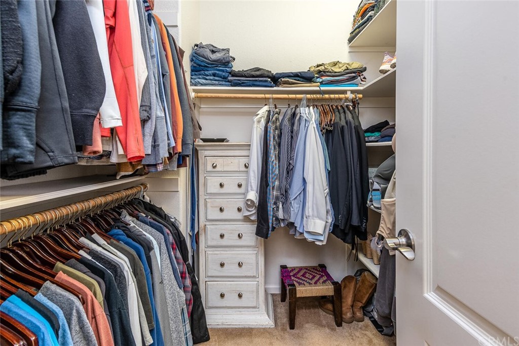 1039 Ford Drive Nipomo, CA 93444 - Photo 19 of 45 a view of walk in closet with clothes and shoes