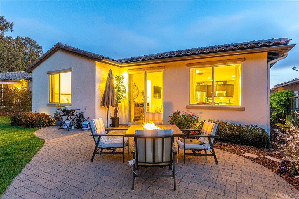 1039 Ford Drive Nipomo, CA 93444 - Photo 30 of 45 a backyard of a house with table and chairs