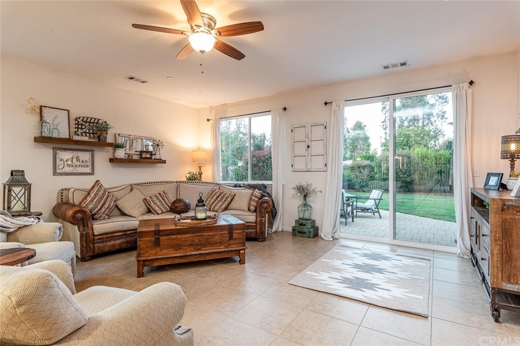 1039 Ford Drive Nipomo, CA 93444 - Photo 8 of 45 a living room with furniture and a floor to ceiling window