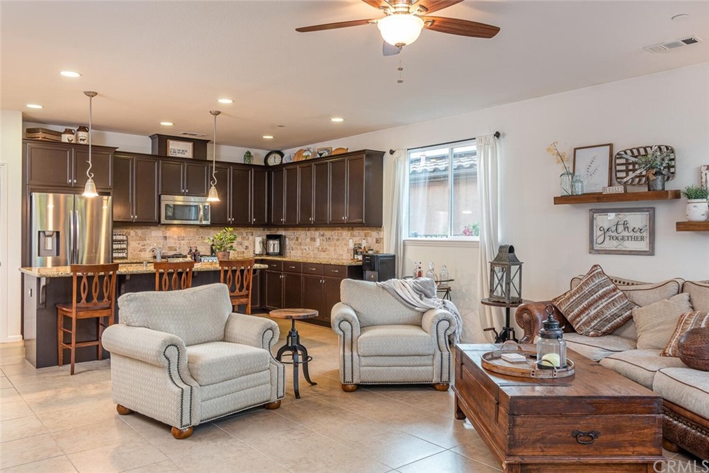 1039 Ford Drive Nipomo, CA 93444 - Photo 10 of 45 a living room with furniture kitchen and a chandelier