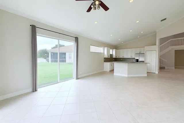 a view of a kitchen with furniture and a window