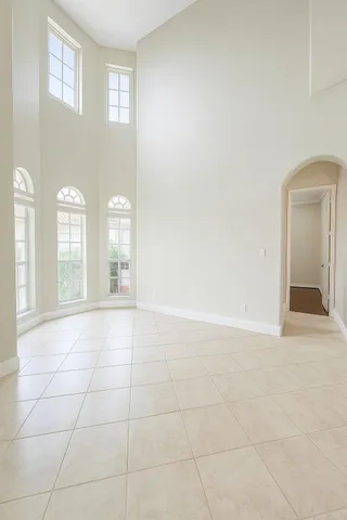 a view of an empty room with glass door