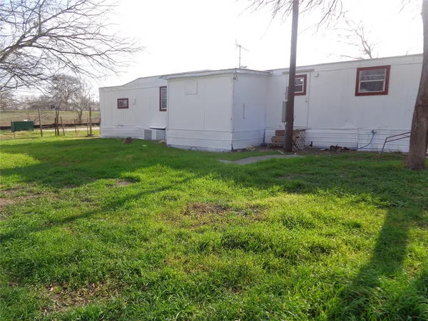 a view of a back yard of the house
