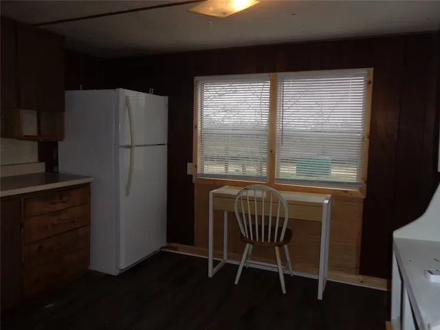 a dining room with a table and chairs