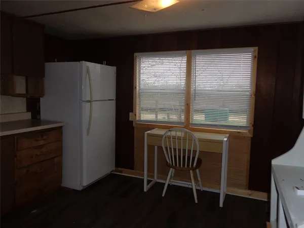 a dining room with a table and chairs