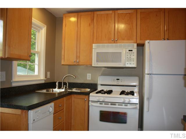 901 North State Street Raleigh, NC 27604 - Photo 3 of 21 The kitchen is cozy, but well designed. The cabinets and countertops have all been replaced and the storage has been maximized. It features a unique stainless double compartment sink with goose neck faucet!