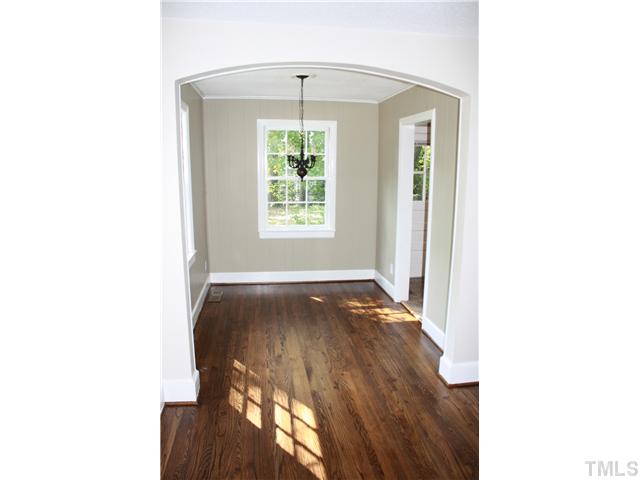 901 North State Street Raleigh, NC 27604 - Photo 4 of 21 A gently sweeping archway invites you into the dining room from the living room. Notice the wide base molding throughout the house. The dining room also has crown molding and a sweet oil-rubbed bronze chandelier.