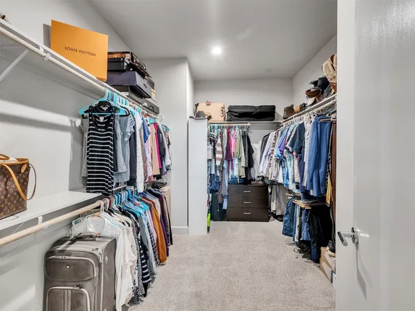 a living room with furniture and a gym machine