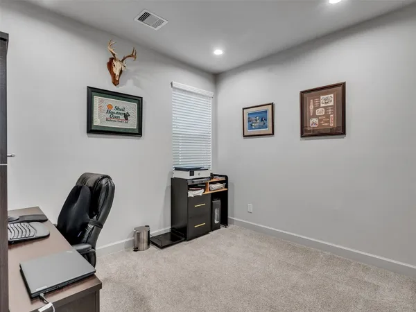 a view of a backyard with wooden fence