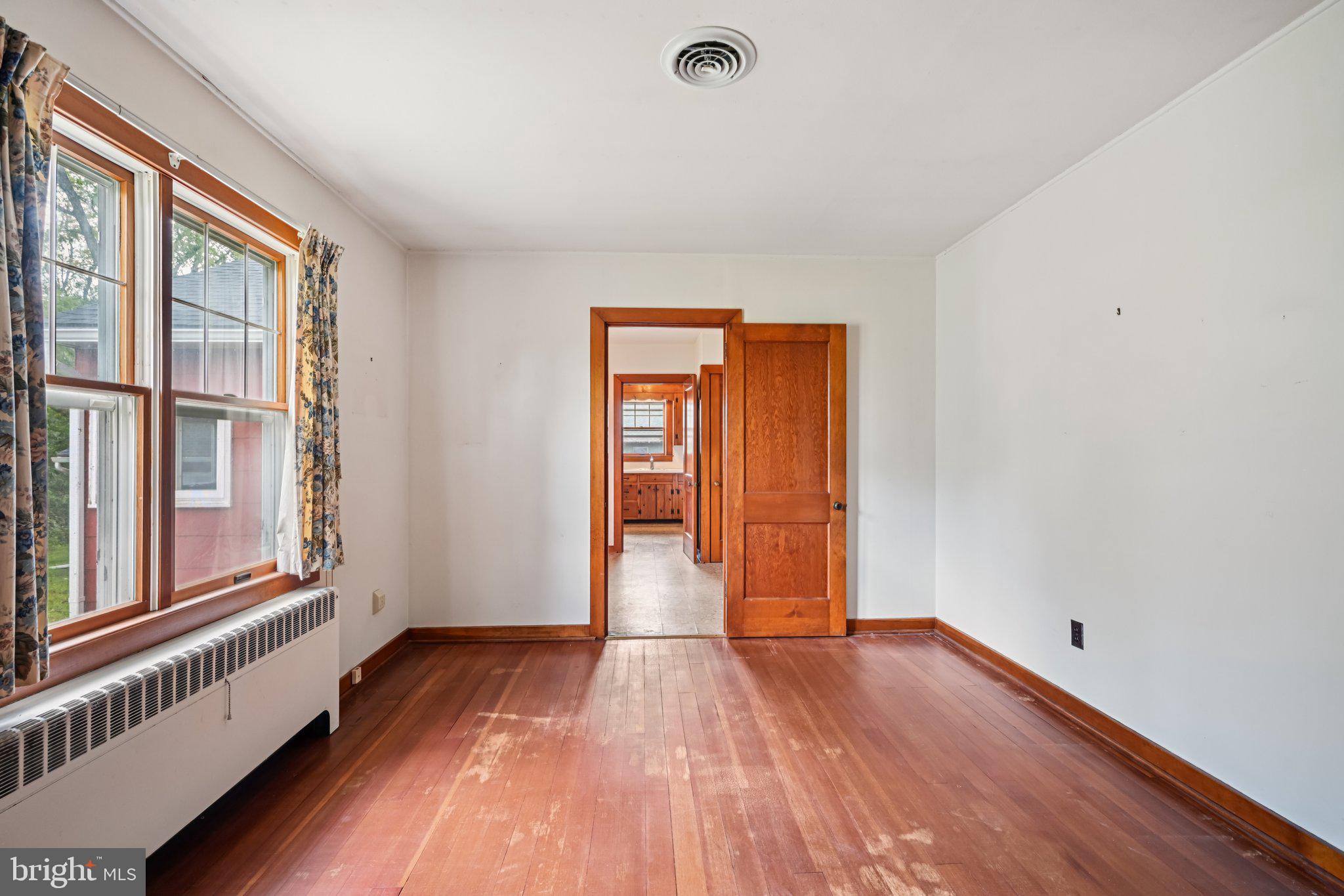 60 Brownback Road Royersford, PA 19468 - Photo 30 of 50 a view of an empty room with wooden floor and a window