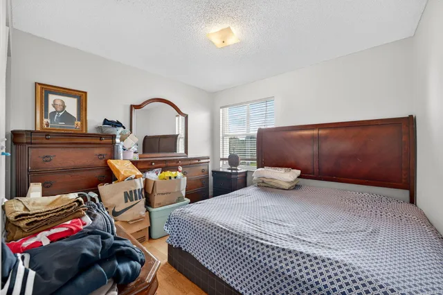a bedroom with furniture and a fireplace