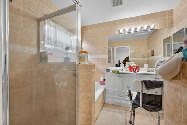 a kitchen with a refrigerator and cabinets