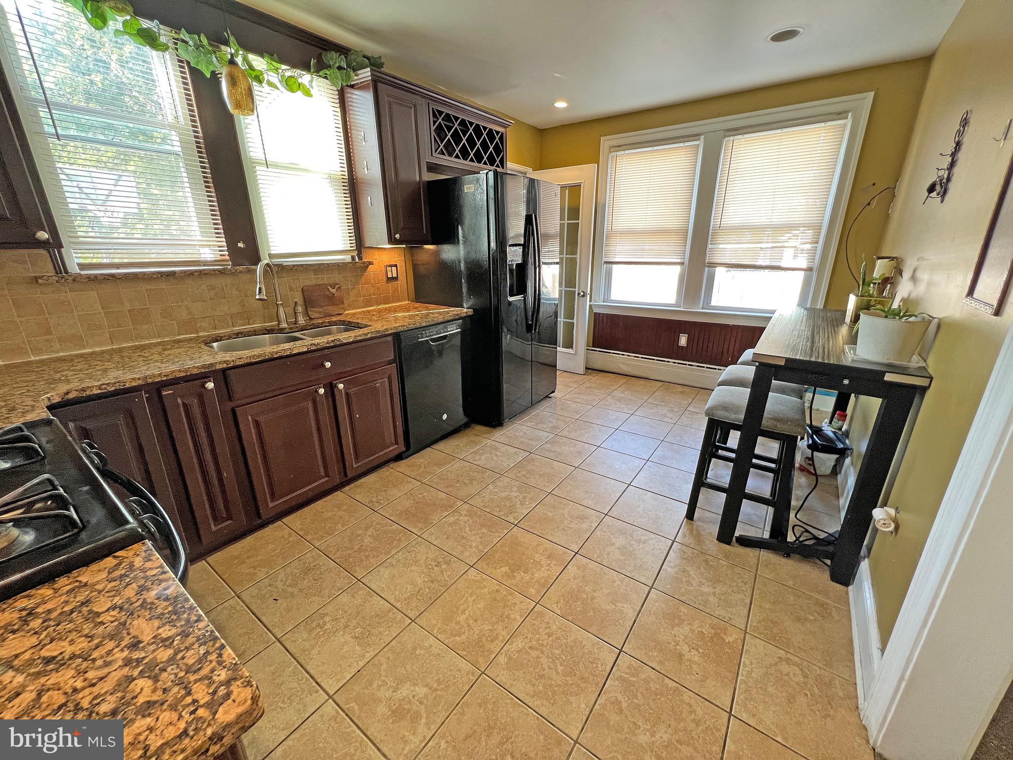 4129 Garrett Road Drexel Hill, PA 19026 - Photo 3 of 34 Kitchen with granite counters, tile backsplash