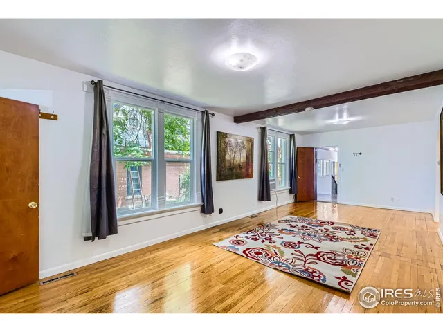 a view of an empty room and window